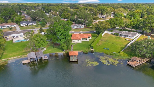 drone / aerial view with a residential view and a water view