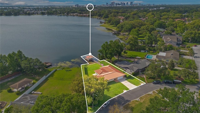 birds eye view of property featuring a water view