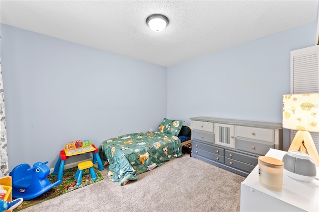 carpeted bedroom with a textured ceiling