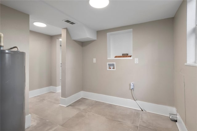 washroom with laundry area, visible vents, baseboards, hookup for a washing machine, and water heater