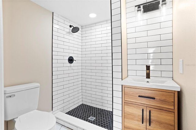 full bath with toilet, a shower stall, and vanity