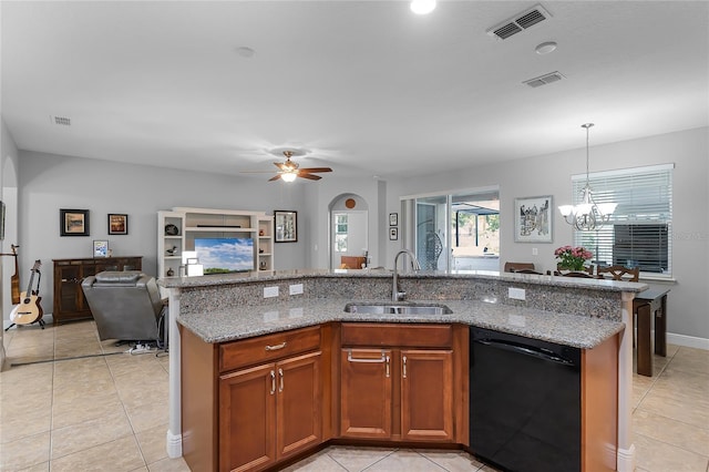 kitchen with visible vents, a sink, light stone counters, open floor plan, and black dishwasher