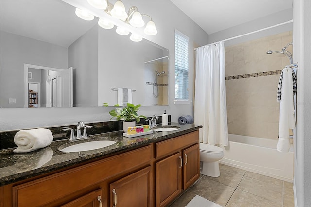 bathroom with a sink, tile patterned floors, double vanity, and shower / bath combination with curtain