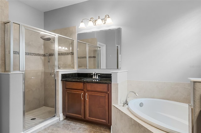 full bath with vanity, a shower stall, and a bath