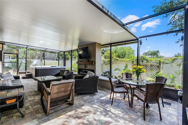 sunroom / solarium featuring a jacuzzi and a wealth of natural light