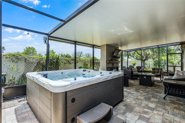 sunroom / solarium with a jacuzzi and an outdoor living space