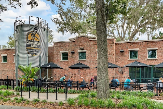 view of building exterior with fence