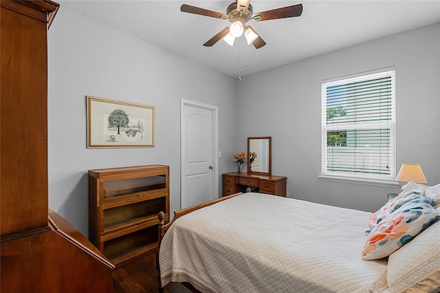 721 Lake Cove Pointe Cir, Winter Garden, FL 34787 - bedroom with wood finished floors and ceiling fan