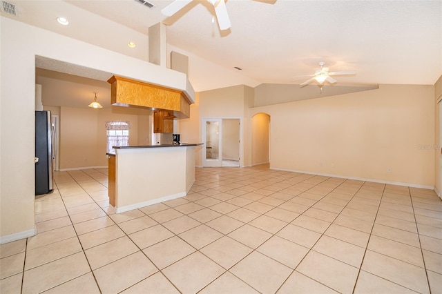 2924 Jebidiah Loop, Saint Cloud, FL 34772 - kitchen with ceiling fan, freestanding refrigerator, lofted ceiling, open floor plan, and light tile patterned flooring