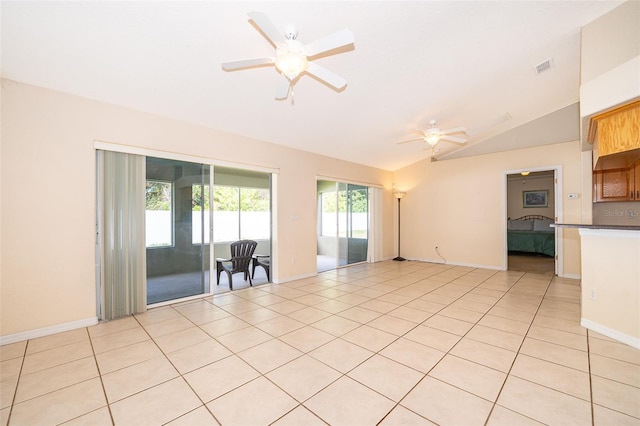 2924 Jebidiah Loop, Saint Cloud, FL 34772 - spare room featuring vaulted ceiling, ceiling fan, light tile patterned flooring, and baseboards