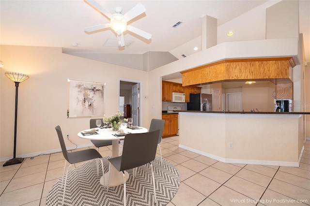 2924 Jebidiah Loop, Saint Cloud, FL 34772 - dining room with lofted ceiling, light tile patterned floors, a ceiling fan, and baseboards