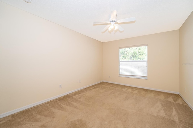 2924 Jebidiah Loop, Saint Cloud, FL 34772 - unfurnished room featuring light carpet, baseboards, and ceiling fan