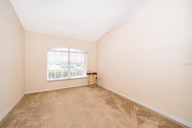 2924 Jebidiah Loop, Saint Cloud, FL 34772 - empty room with light colored carpet, baseboards, and lofted ceiling