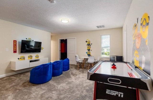 game room with a textured ceiling, billiards, visible vents, and carpet floors