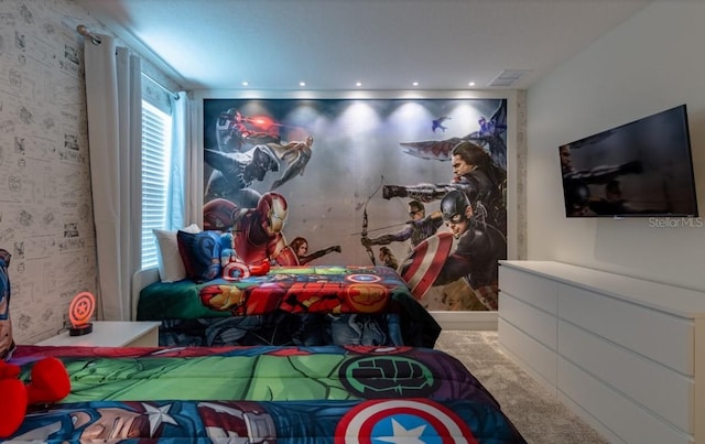 carpeted bedroom featuring wallpapered walls and visible vents