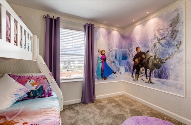 bedroom with baseboards, multiple windows, and carpet