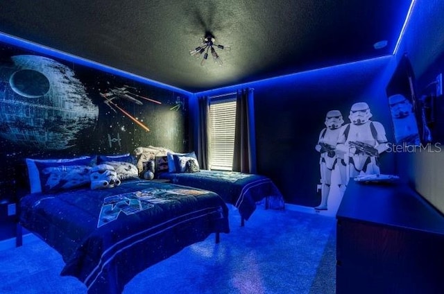 carpeted bedroom with a textured ceiling