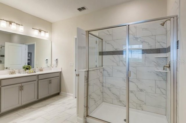 bathroom featuring a sink, marble finish floor, visible vents, a shower stall, and double vanity