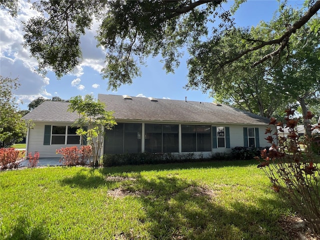 6042 Wade St, Leesburg, FL 34748 - back of property featuring a sunroom and a yard