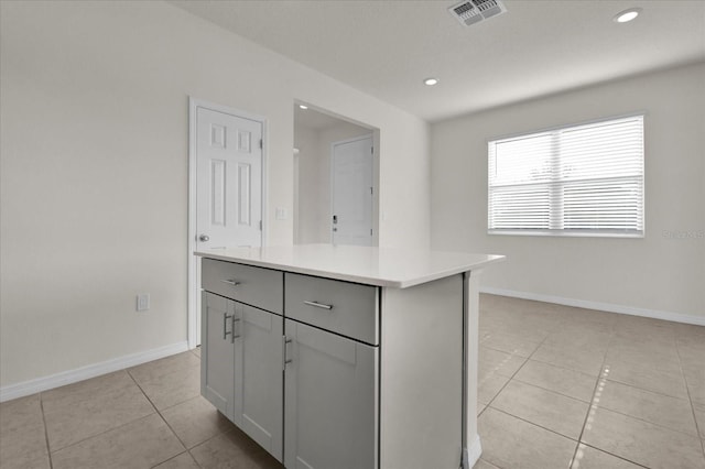 kitchen featuring light tile patterned floors, recessed lighting, visible vents, and light countertops