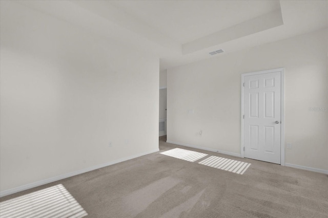 unfurnished room featuring baseboards, visible vents, and carpet floors