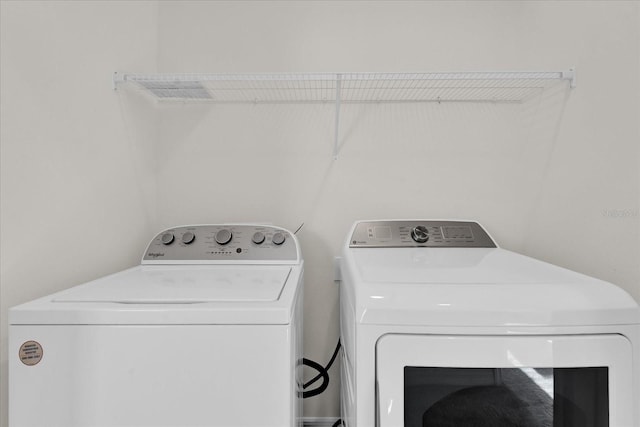 laundry room featuring separate washer and dryer