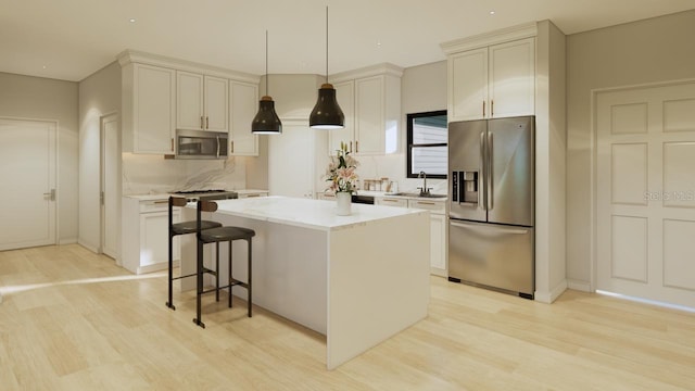 6168 SW 154th St, Ocala, FL 34473 - kitchen featuring stainless steel appliances, light wood-style flooring, a sink, and tasteful backsplash