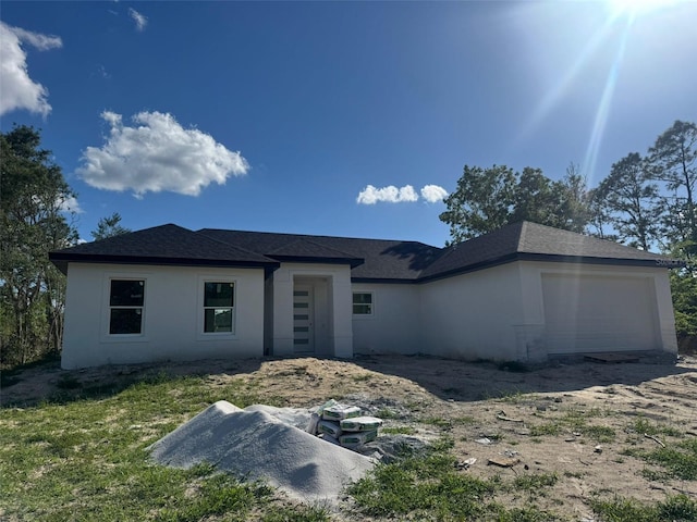 6168 SW 154th St, Ocala, FL 34473 - prairie-style home with stucco siding and a garage