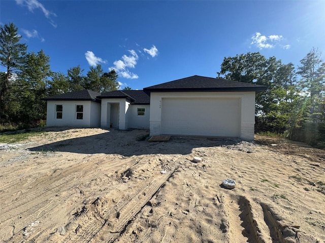 6168 SW 154th St, Ocala, FL 34473 - view of front of house with stucco siding and a shingled roof