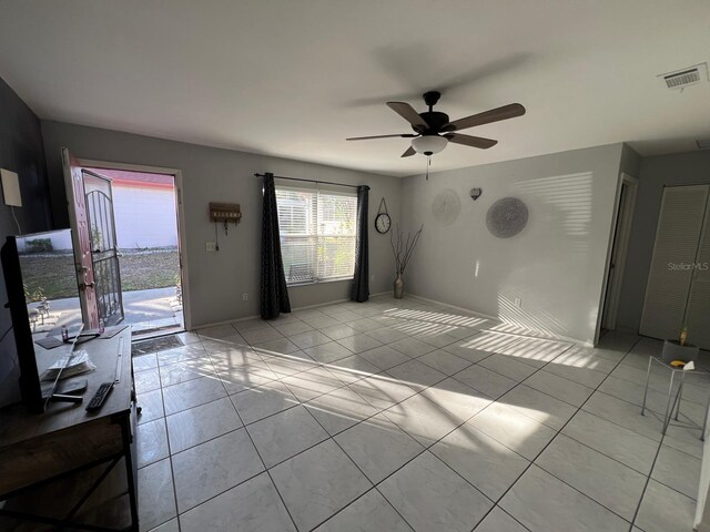 68 S Marbrisa Way, Kissimmee, FL 34743 - interior space with visible vents, a ceiling fan, baseboards, and light tile patterned floors