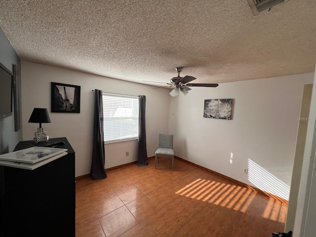 68 S Marbrisa Way, Kissimmee, FL 34743 - unfurnished room featuring ceiling fan, a textured ceiling, and visible vents