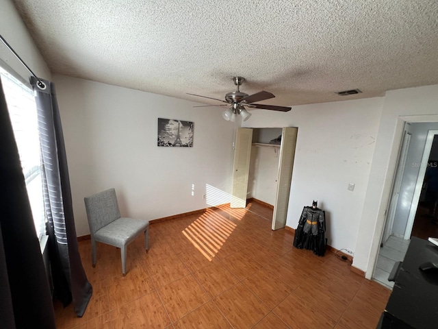 68 S Marbrisa Way, Kissimmee, FL 34743 - interior space featuring a textured ceiling, ceiling fan, visible vents, and a closet