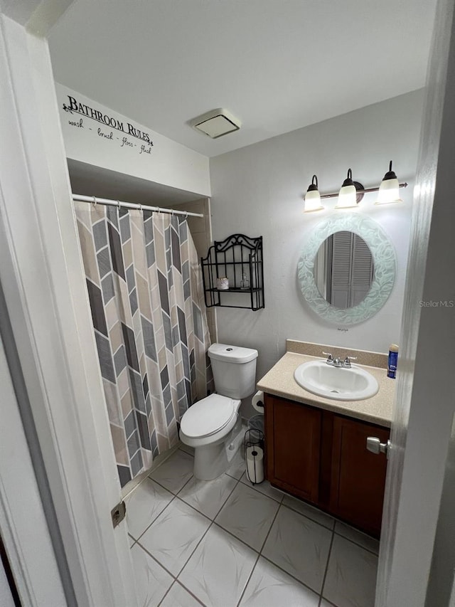68 S Marbrisa Way, Kissimmee, FL 34743 - full bathroom featuring vanity, marble finish floor, curtained shower, and toilet