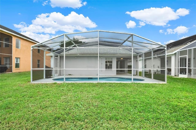 4347 Creekside Blvd, Kissimmee, FL 34746 - rear view of property with a yard, an outdoor pool, and a lanai