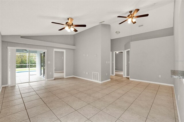 4347 Creekside Blvd, Kissimmee, FL 34746 - spare room with a ceiling fan, light tile patterned floors, baseboards, and high vaulted ceiling
