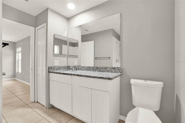 4347 Creekside Blvd, Kissimmee, FL 34746 - bathroom featuring vanity, toilet, and tile patterned floors