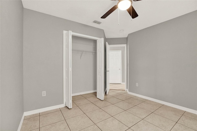 4347 Creekside Blvd, Kissimmee, FL 34746 - unfurnished bedroom with light tile patterned flooring, a closet, and baseboards
