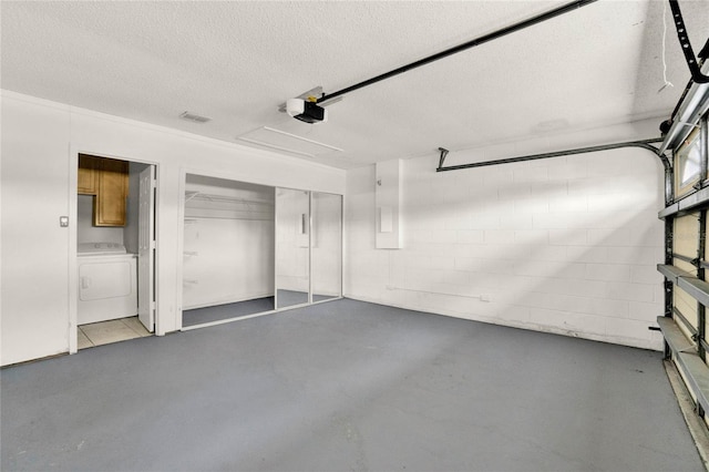 4347 Creekside Blvd, Kissimmee, FL 34746 - garage featuring washer / clothes dryer, a garage door opener, and concrete block wall