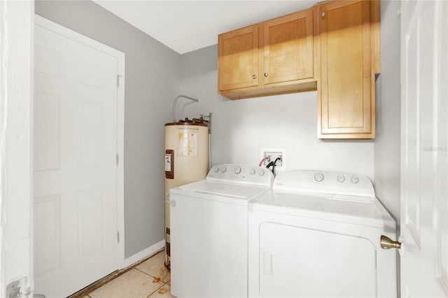 4347 Creekside Blvd, Kissimmee, FL 34746 - laundry area featuring cabinet space, washing machine and dryer, electric water heater, light tile patterned floors, and baseboards
