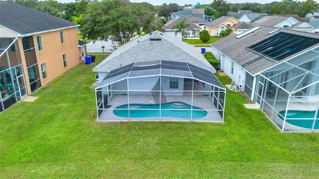 4347 Creekside Blvd, Kissimmee, FL 34746 - rear view of property with an outdoor pool, a patio, a lanai, and a lawn