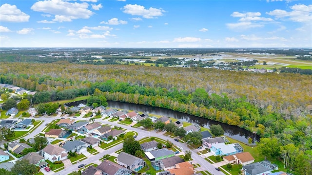 4347 Creekside Blvd, Kissimmee, FL 34746 - aerial view of property and surrounding area with a forest, a large body of water, and nearby suburban area