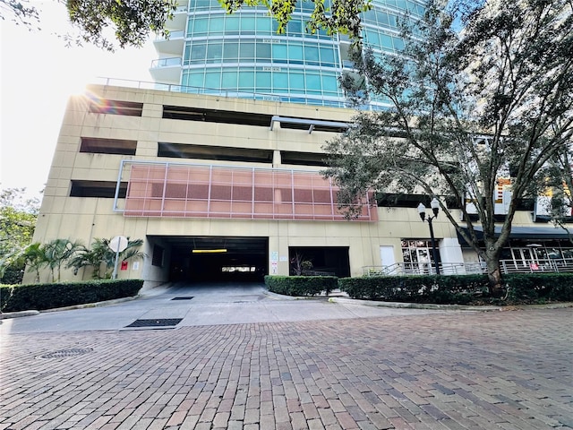 view of building exterior with a garage and driveway