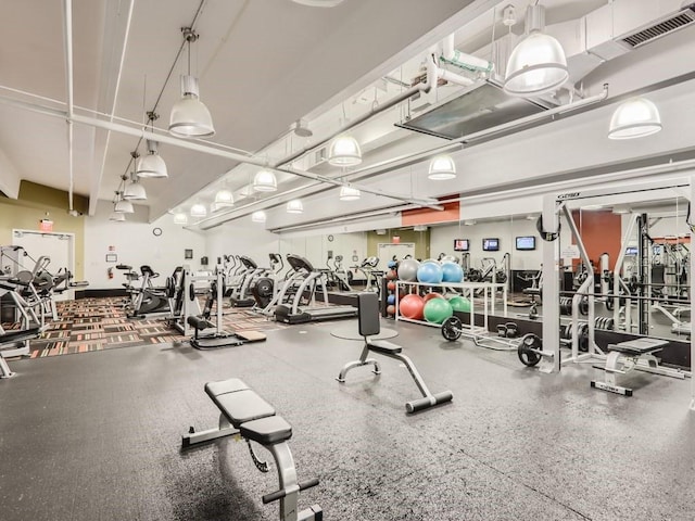 exercise room featuring visible vents
