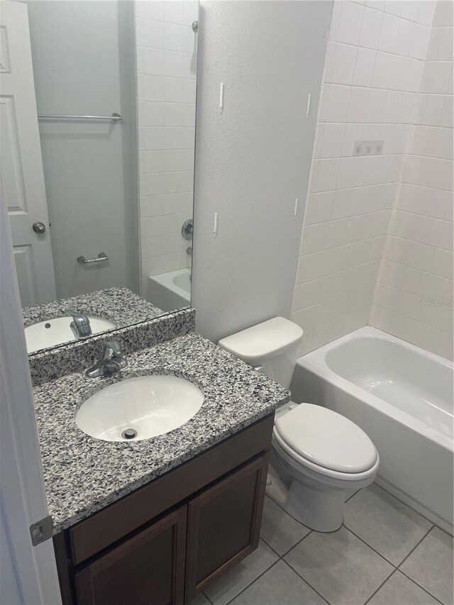 bathroom with toilet, tile patterned floors, shower / bathtub combination, and vanity
