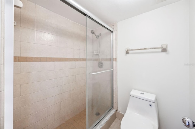 full bathroom with toilet and a shower stall