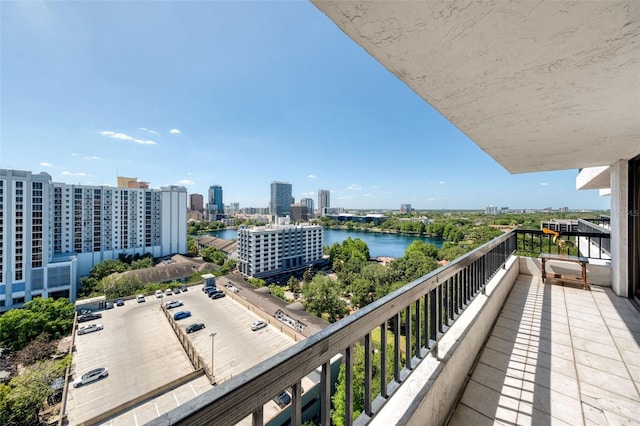 balcony with a view of city and a water view