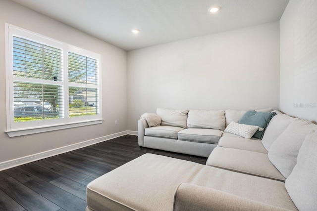 living area featuring recessed lighting, baseboards, and dark wood-style floors