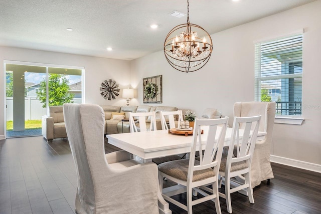 dining room with recessed lighting, baseboards, dark wood finished floors, and a chandelier