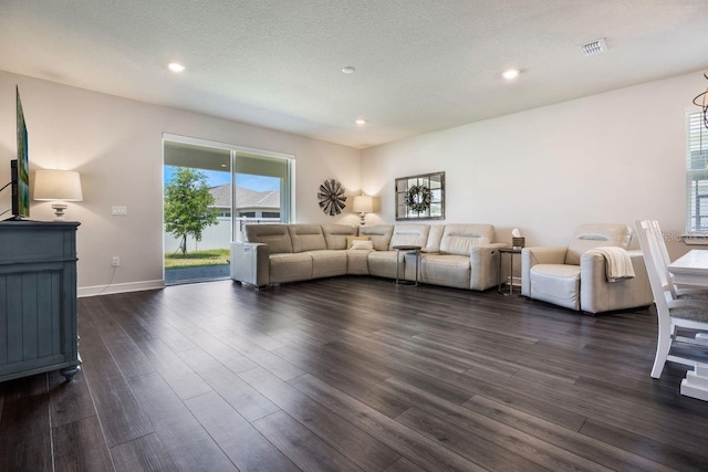 living room featuring recessed lighting, baseboards, dark wood finished floors, and visible vents