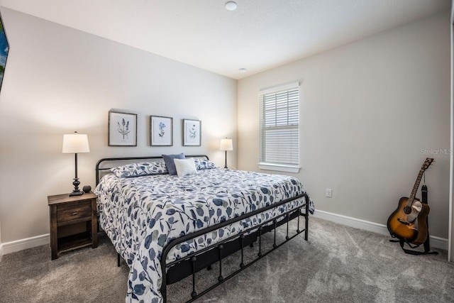 bedroom with carpet floors and baseboards
